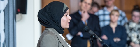 Photo of then-BA student Nadine Jawad addressing a crowd at the Ford School in celebration of Betty Ford