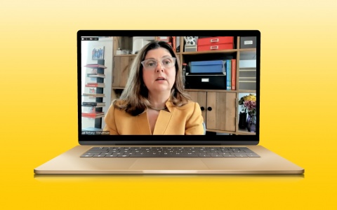 Screenshot of the recording of Professor Stevenson's testimony, placed into a computer mockup on a maize gradient background