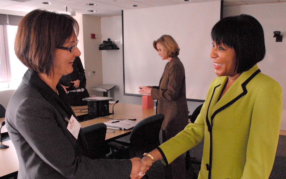 Elisabeth Gerber shakes hands at Applied Policy Seminar