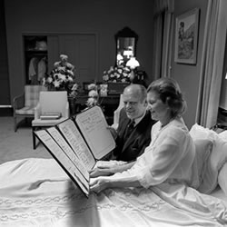 President Gerald Ford and First Lady Betty Ford read a get well card following the First Lady's breast cancer surgery.