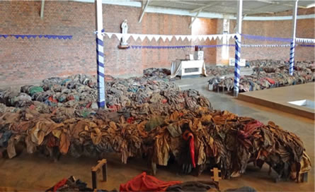 piled clothes of genocide victims at Nyamata Genocide Memorial