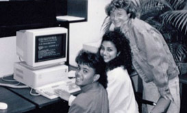 Students with Borish-donated computer, 1990