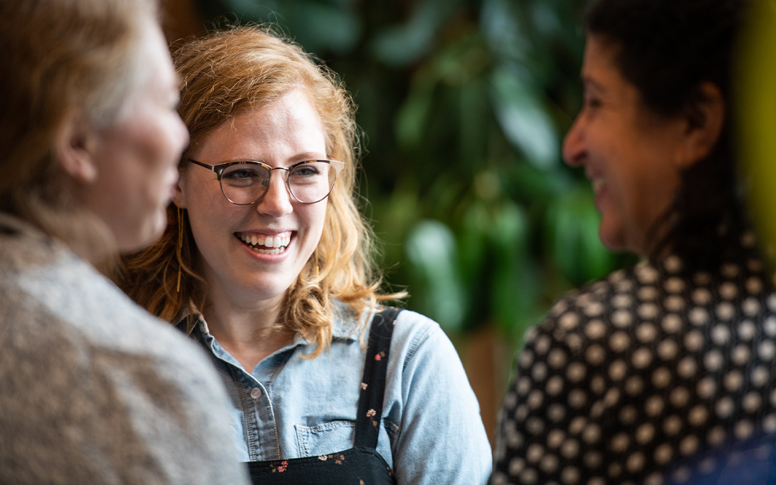 Smiling people at the commencement open house