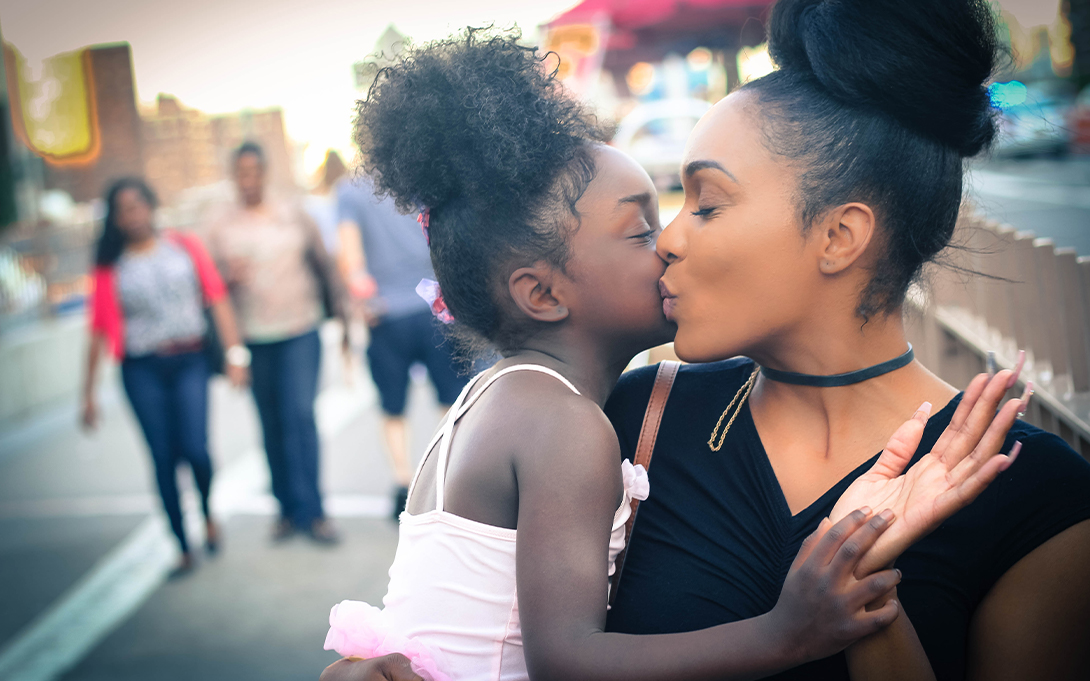 Photo of a mother and her young daughter