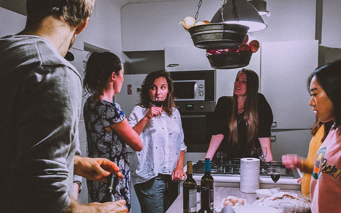 Friends gathered in the kitchen