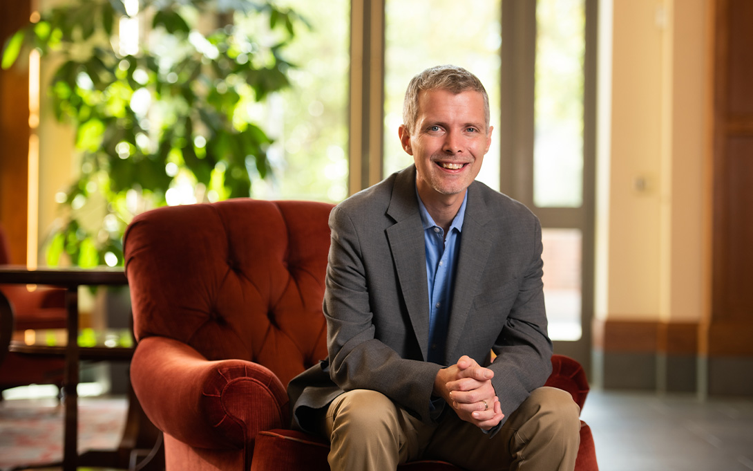 Photo of Luke Shaefer seated in Weill Hall's Great Hall