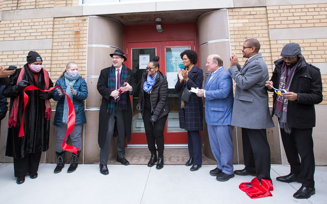 People at the ribbon cutting of an open business