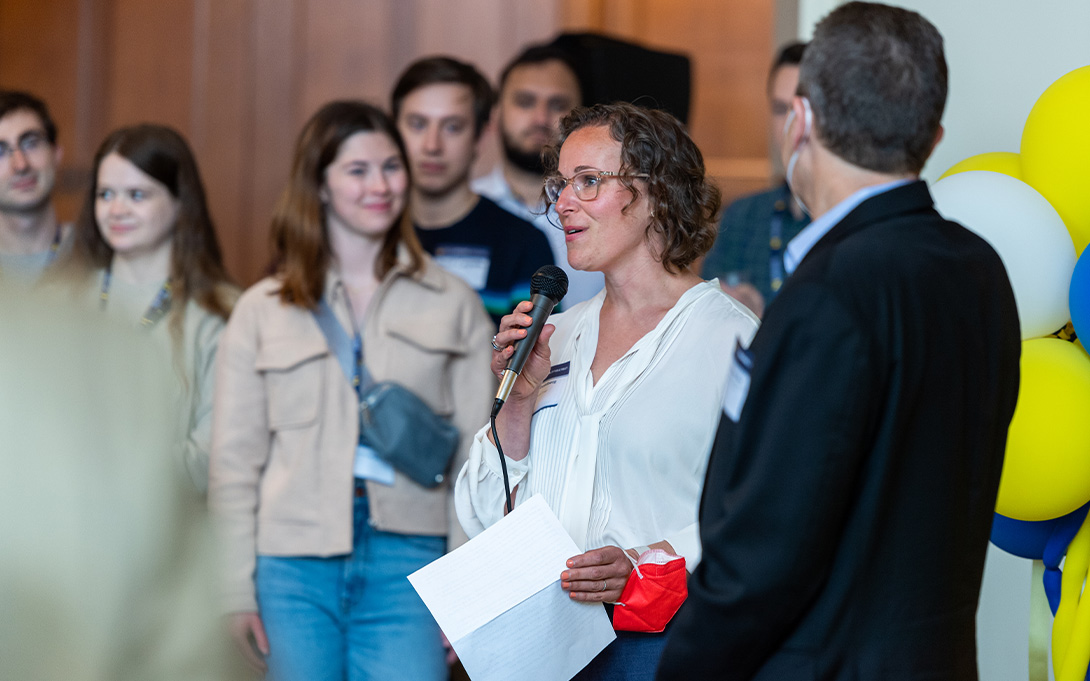 Photo of Naomi Goldberg addressing attendees of the Class of 2020 Comeback Commencement reception in the Great Hall