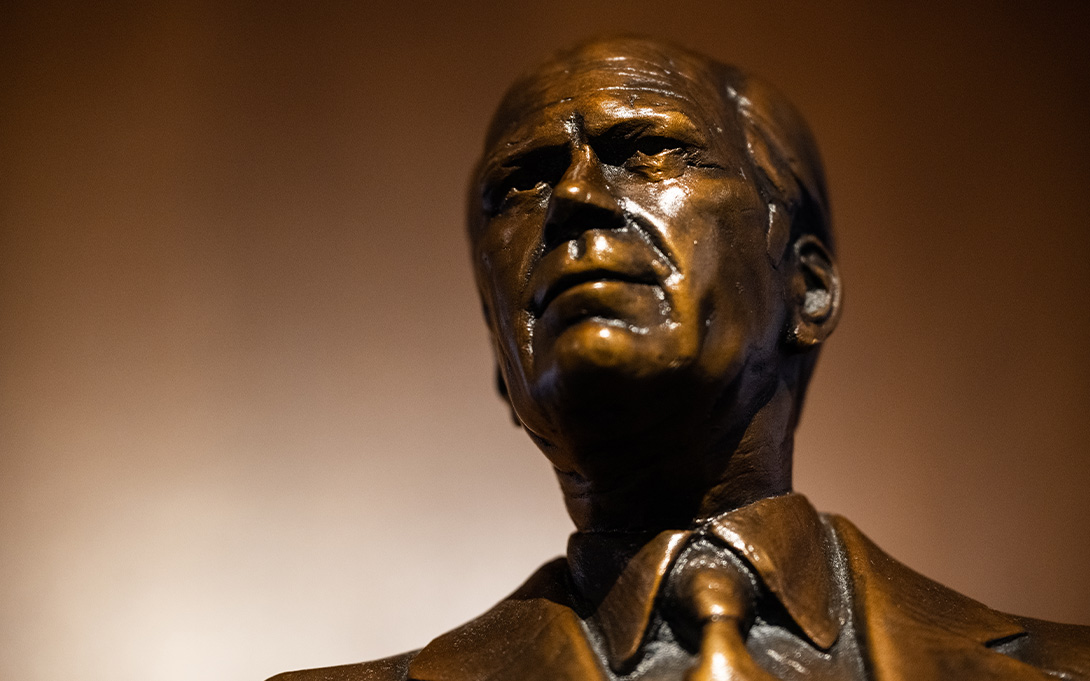 Photo of a bronze statue of President Ford in Weill Hall's Great Hall