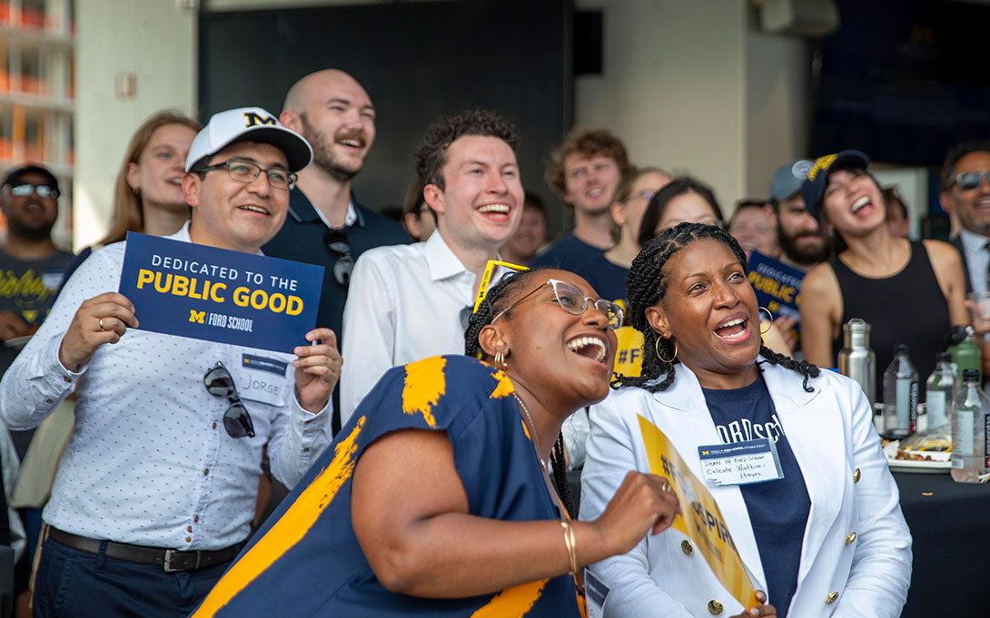 Celeste Watkins-Hayes and attendees of 2023 Spirit Day in DC smiling and posing for a selfie