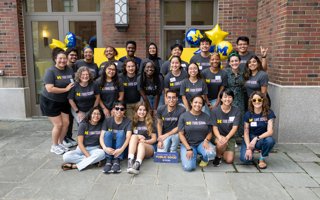 Group of PPIA students posing in front of Gerald R. Ford School of Public Policy courtyard