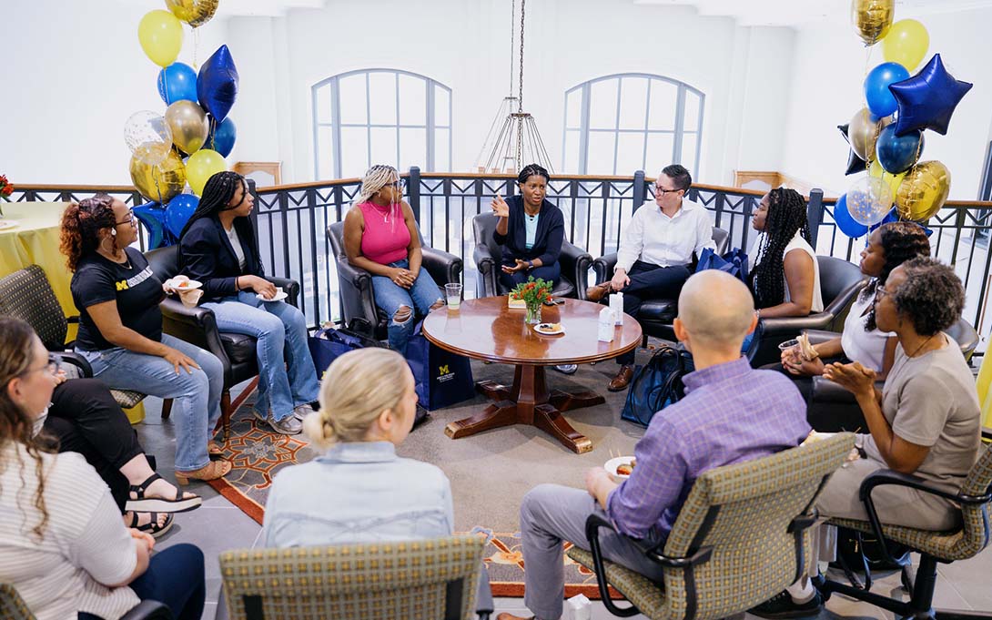 Dean Watkins-Hayes and ASPIRE students gathering on the balcony overlooking the Great Hall