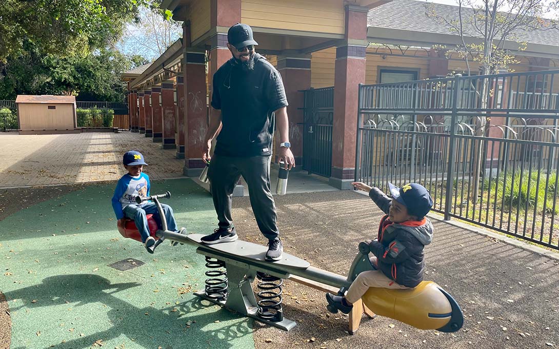 Melvin Gaines and two kids at the park