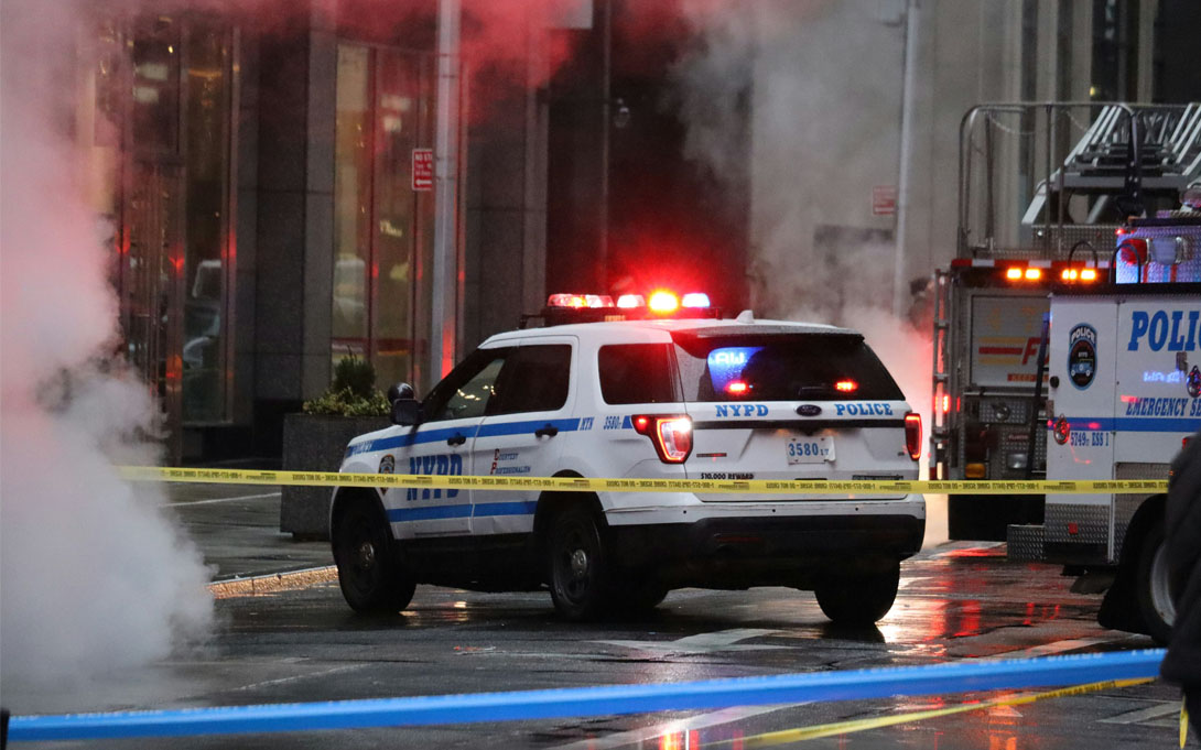 Photo of NYPD SUV and caution tape