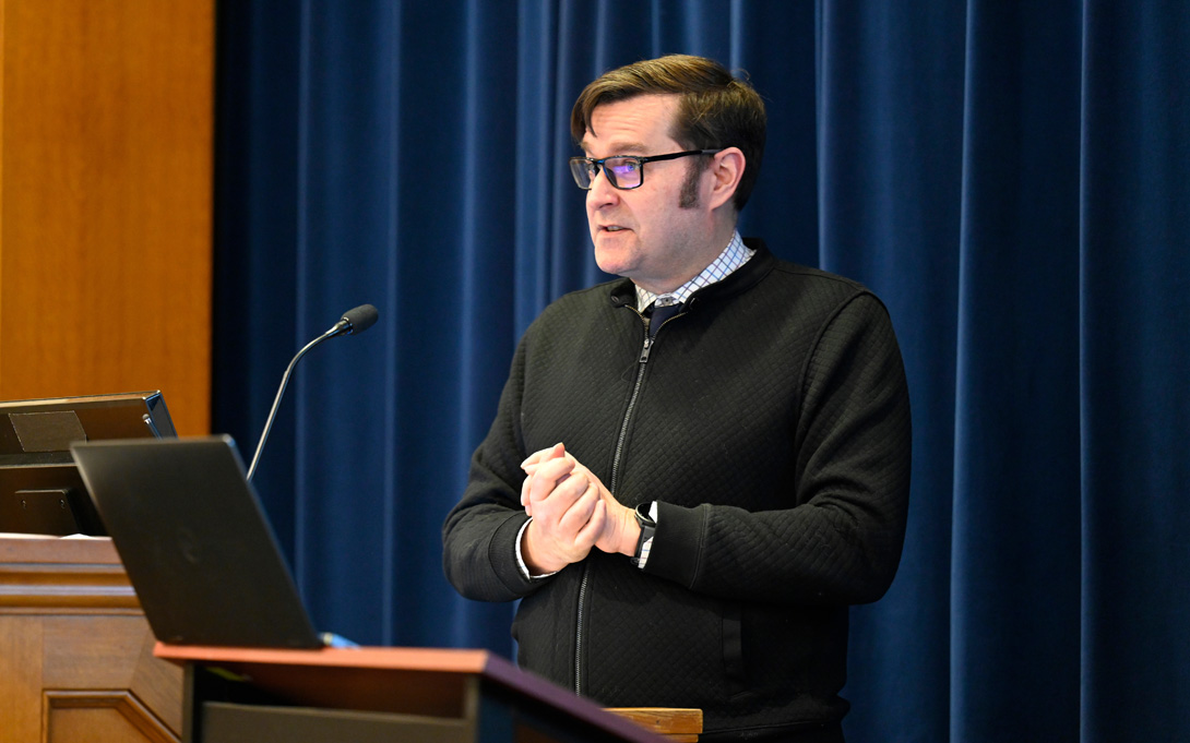 Photo of Kevin Stange giving a policy talk.