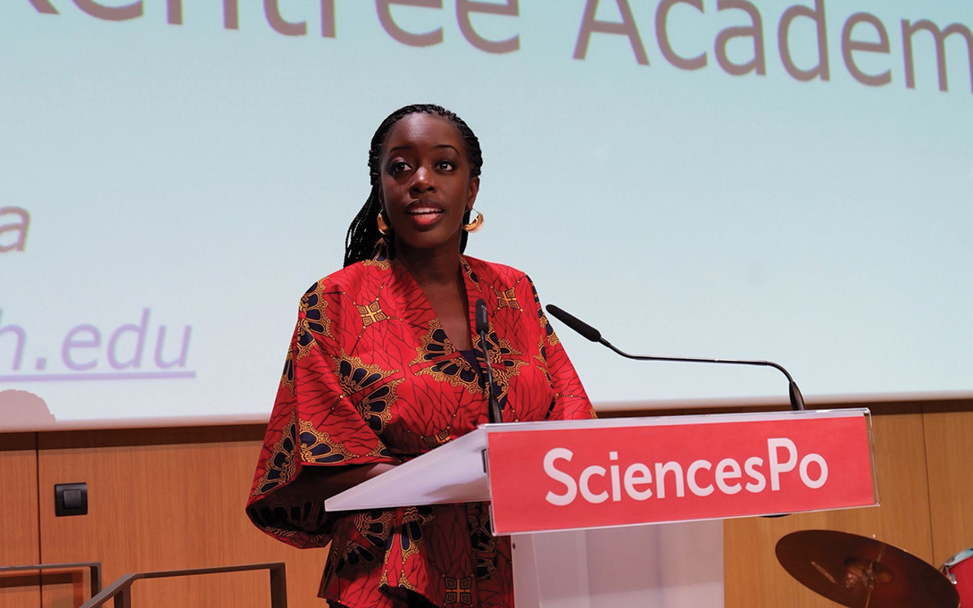 Ambassador Kamissa Camara speaking at podium