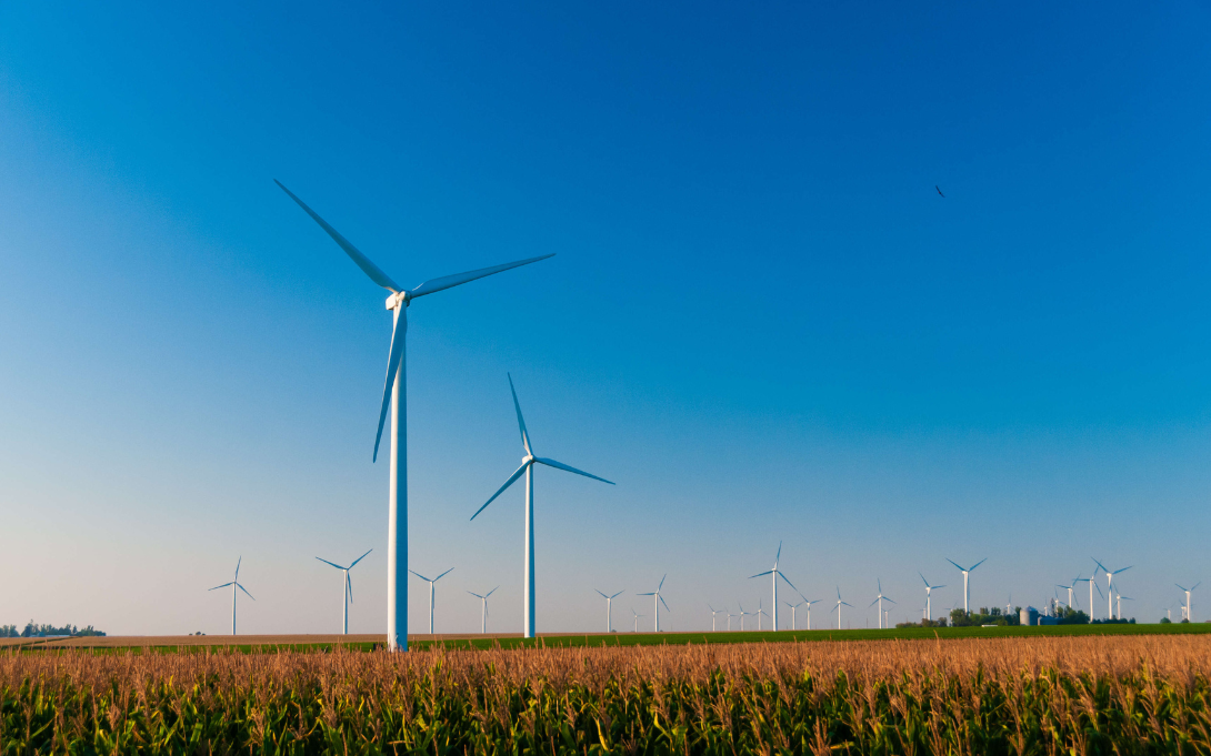 Large wind turbine farm against a blue sky at sunset, Dexter, Minnesota, USA