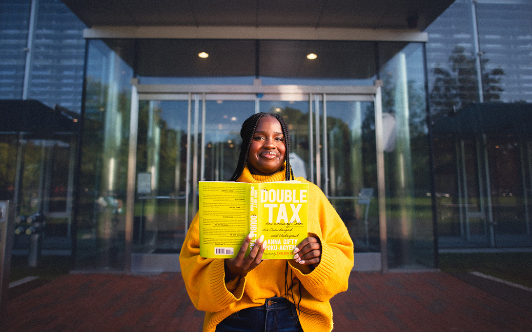 Anna Gifty Opoku-Agyeman holding her book