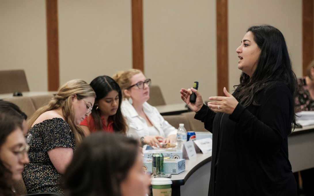 Person instructing class of college students