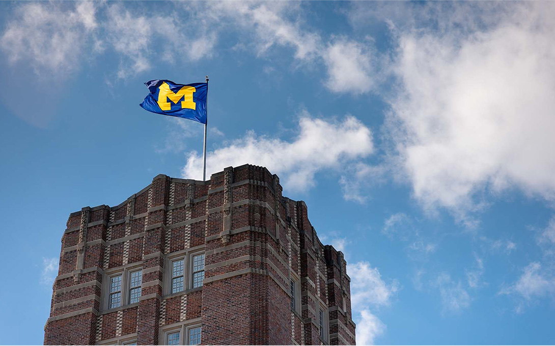 University of Michigan flag flying over the Michigan Union