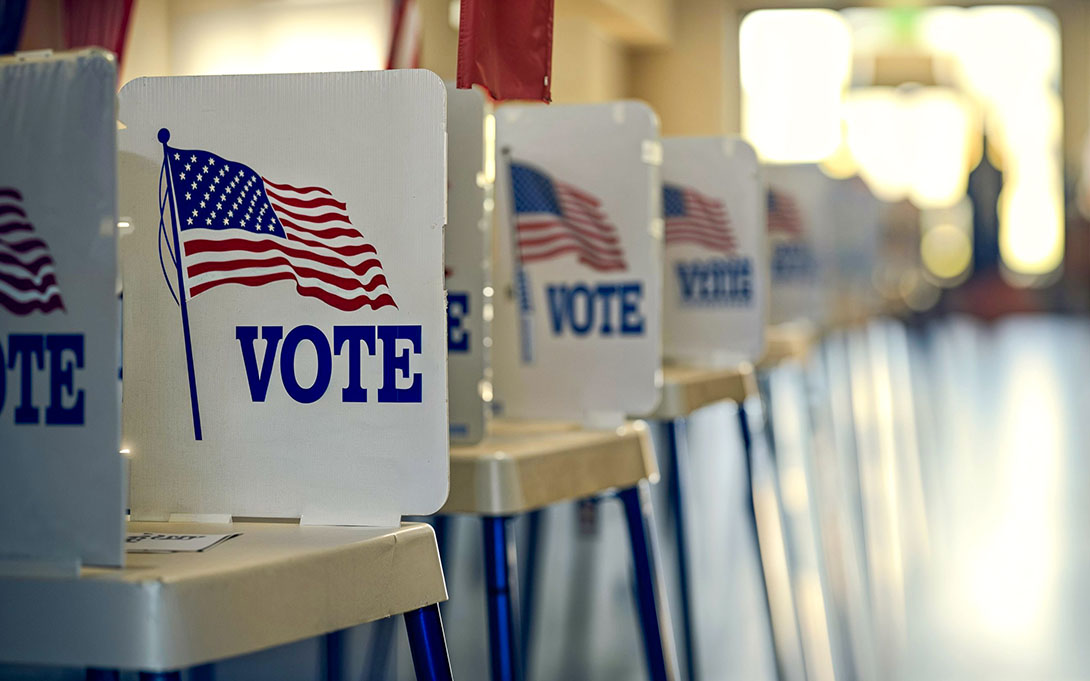 Scene of a line of voting booths