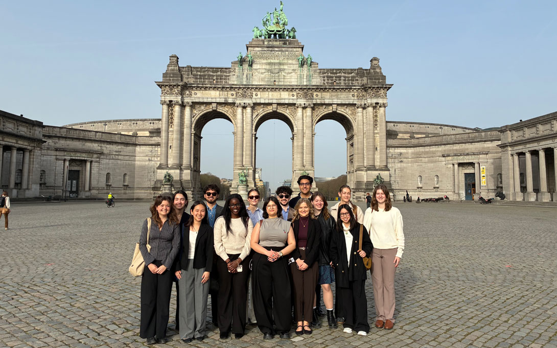 Students posing in front of the Cinquantenaire Arch in Brussels, Belgium.