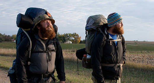 Veterans Tom Voss and Anthony Anderson begin trekking at sunrise in Iowa.