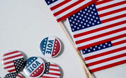 American Flags and Pins on White Background