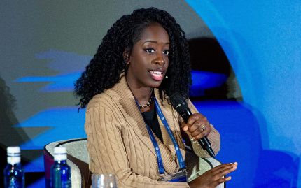 Photo of Ambassador Kamissa Camara speaking on stage at the European Union Trilateral Commission