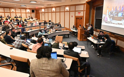 Students in Walter and Leonore Annenberg Auditorium participating in IPE 2025