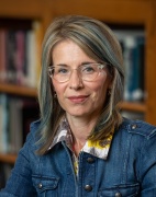 Headshot of Molly Spencer in the Ford School's Towsley Reading Room