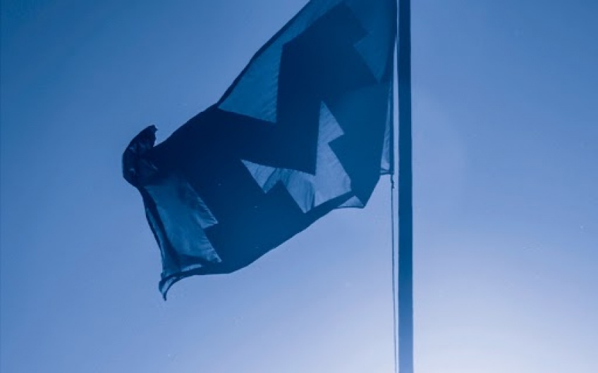 Photo of a Michigan flag, hued blue