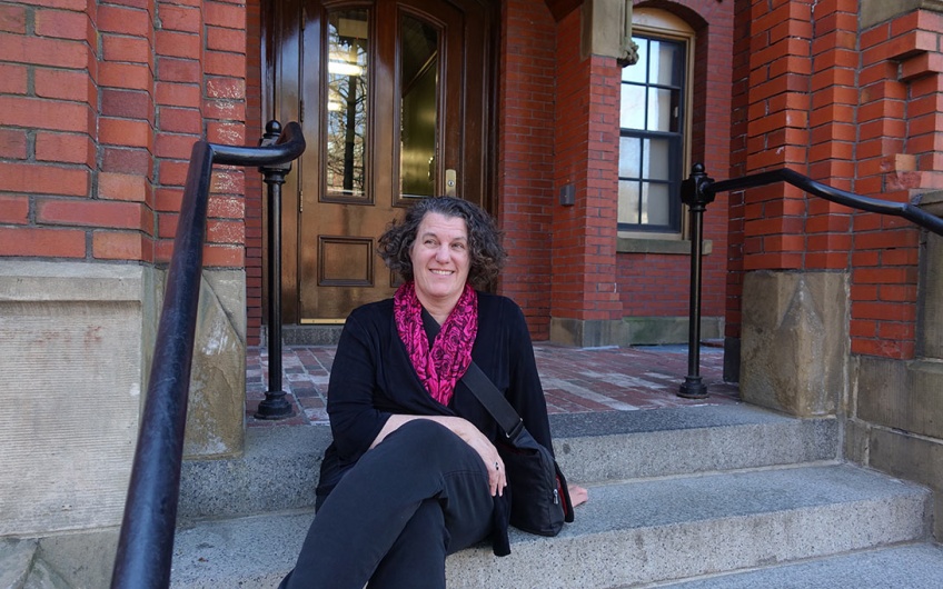 Susan Dynarski sits outside her Harvard freshman dorm