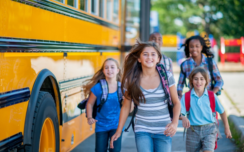 Students and a school bus