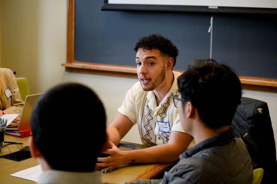 Student speaks with colleauges