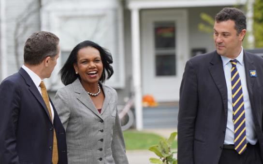 Michael S Barr, former Secretary of State Condoleezza Rice, and John Ciorciari walking outside in Ann Arbor