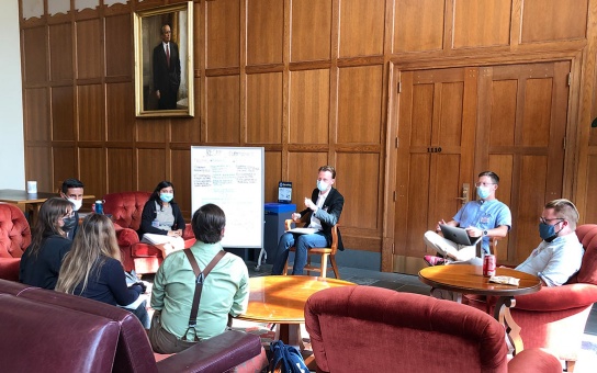 Photo of students seated in the Great Hall as part of the US Army War College simulation