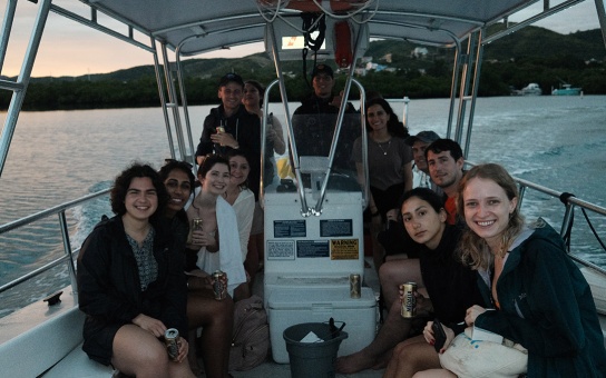Students aboard a boat in Puerto Rico's bioluminescent bay
