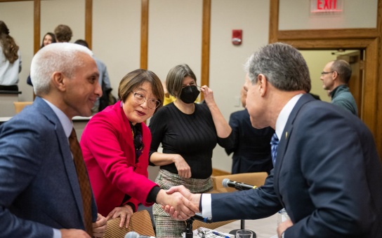 Photo of Ann Chih Lin greeting FBI Director Christopher Wray as Javed Ali looks on