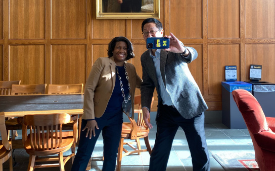 Celeste Watkins Hayes and Santa Ono pose for selfie