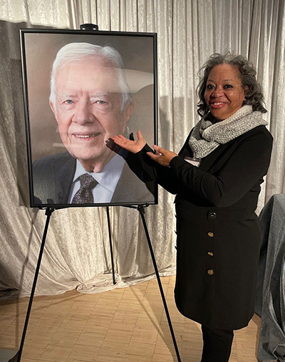 Ambassador Page with a portrait of President Carter