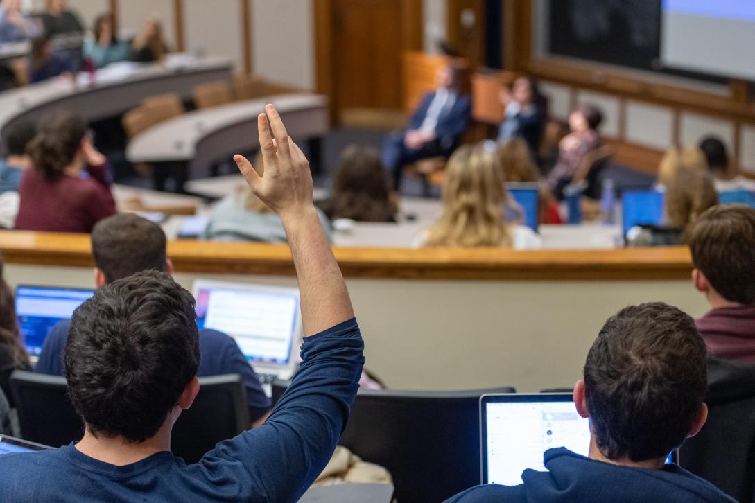 Student raises hand in Annenberg room