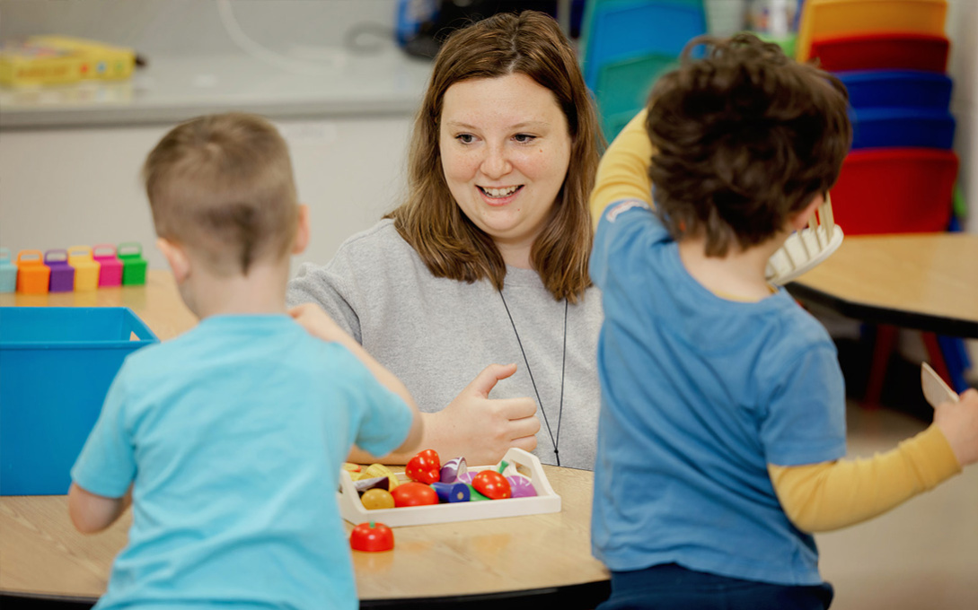 Photo of Sadie Riley-Flemming plays with kids at Blackbird Child Care Center in Harbor Springs on April 19, 2024