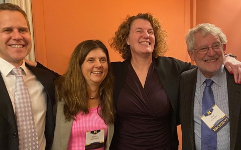 Michael S. Barr, Betsey Stevenson, Susan Dynarski, and Paul Courant posed for a group photo