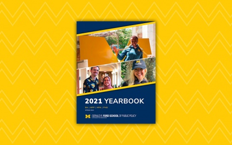Yearbook cover on top of a maize, zigzag patterned background