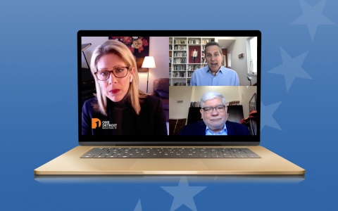 Image of a laptop, open, displaying a video with DPTV host Christy McDonald, Ford School Dean Michael Barr, and Detroit Free Press Editor and Vice President Peter Bhatia