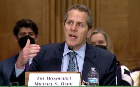 Photo of Michael Barr addressing members of the U.S. Senate Committee on Banking, Housing, and Urban Affairs in person at the Dirksen Senate Office Building