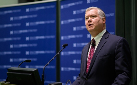 Photo of Stephen Biegun standing at a podium and speaking at an event