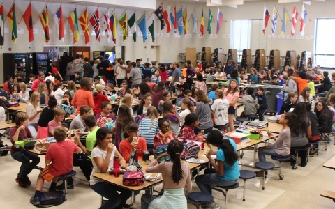 Photo of a cafeteria filled with middle school students 