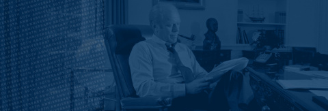Image of Gerald Ford reading a paper with 50th anniversary overlayed on top